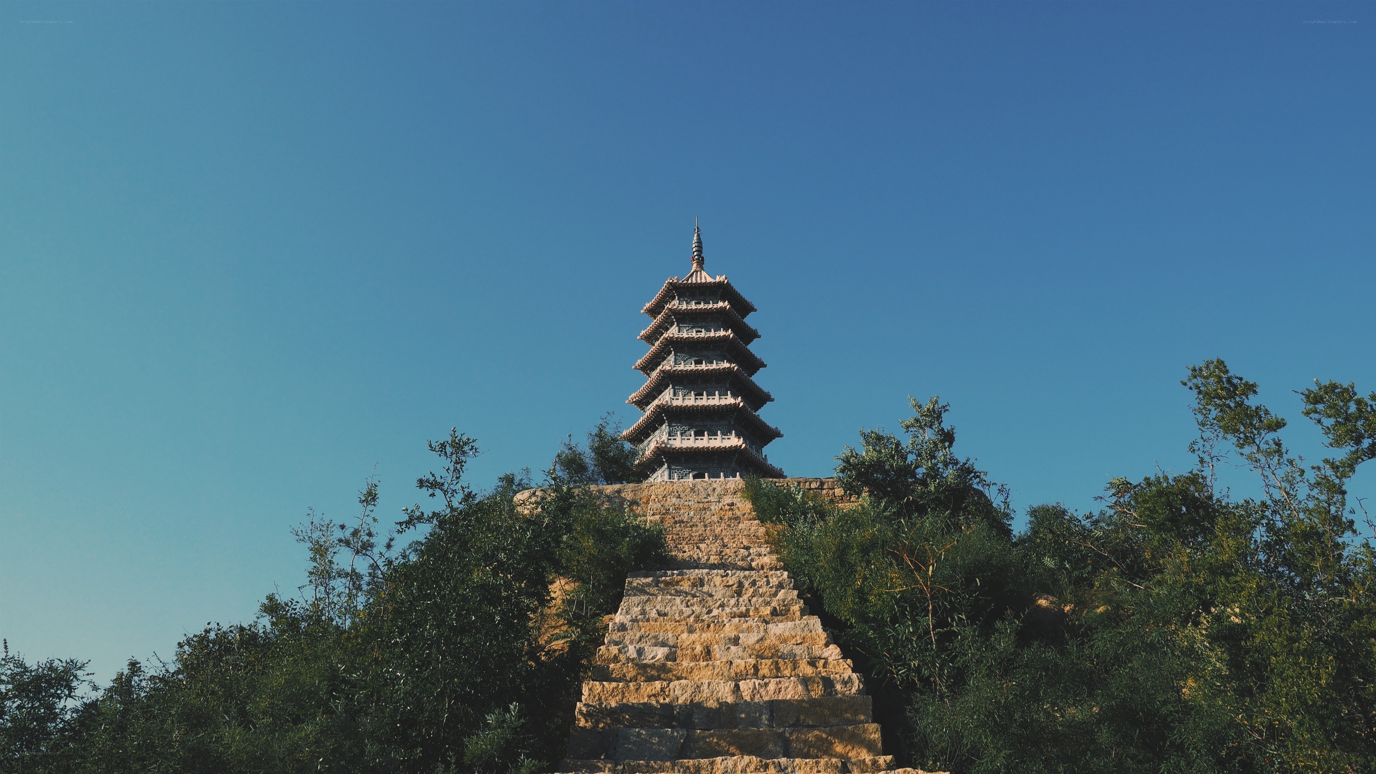 Pagoda on a hill under blue sky