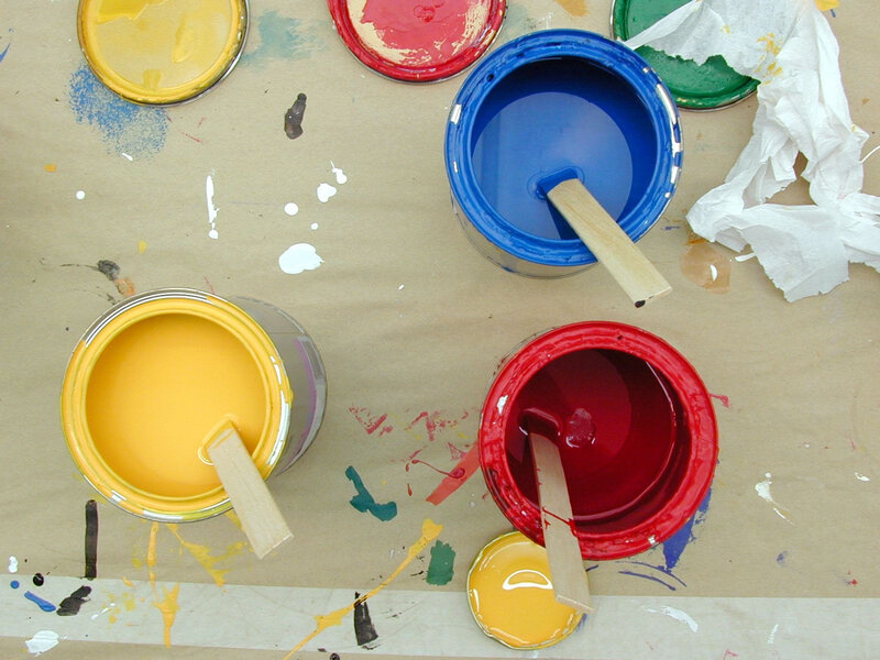 Paint cans on a work surface