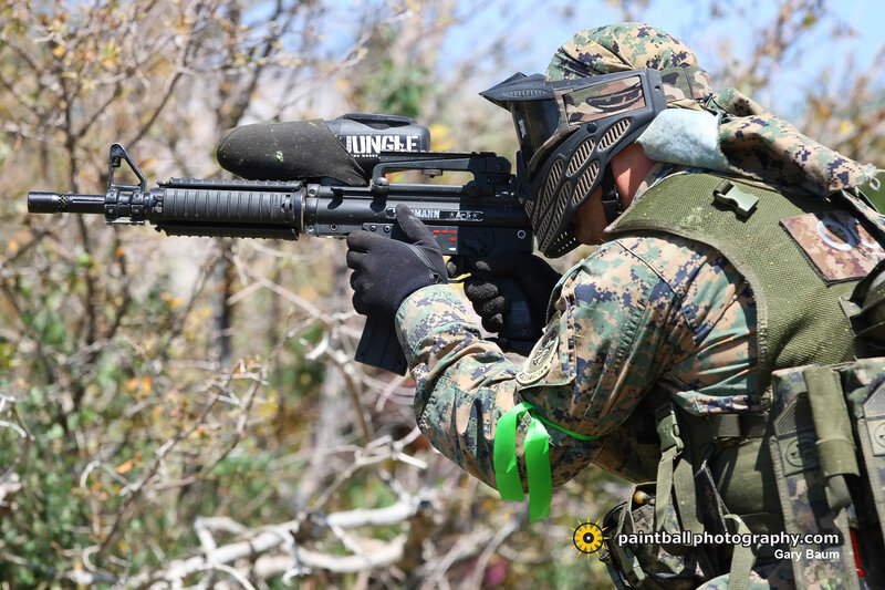 paintball player in camouflage gear