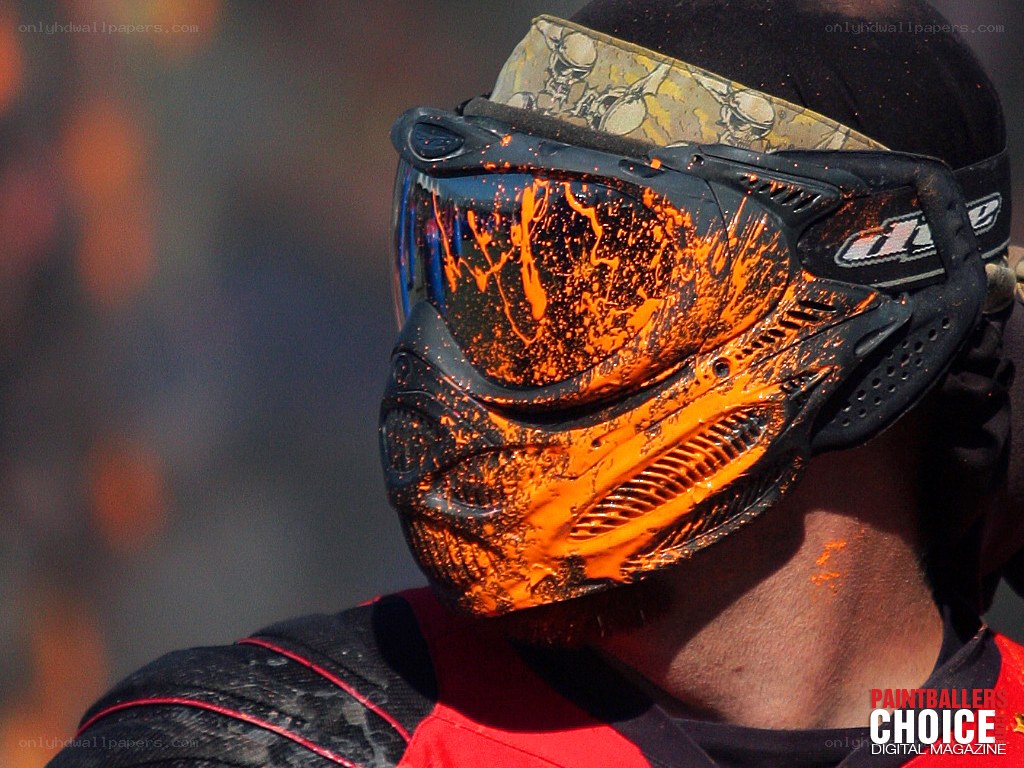 paintball player with splattered mask
