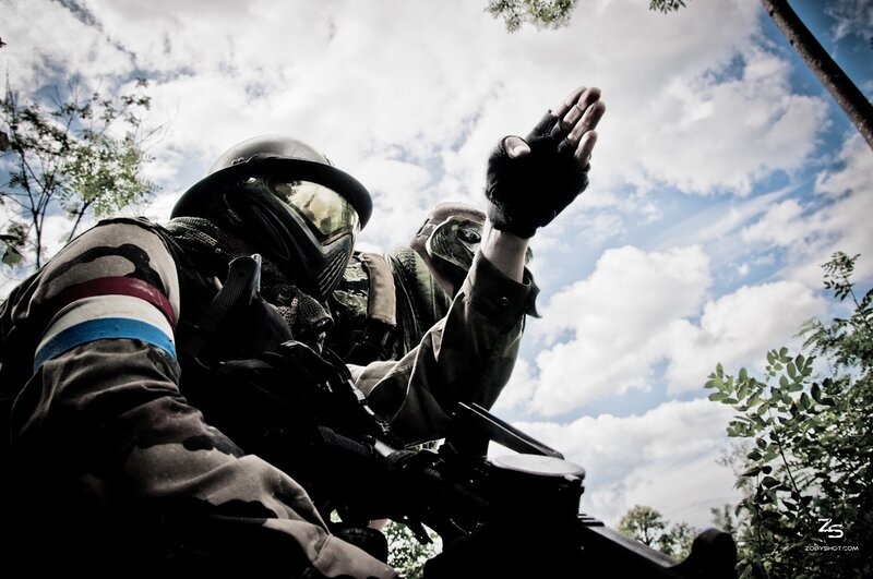 Paintball players in action