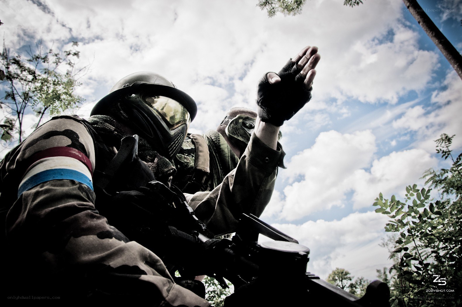 Paintball players in action