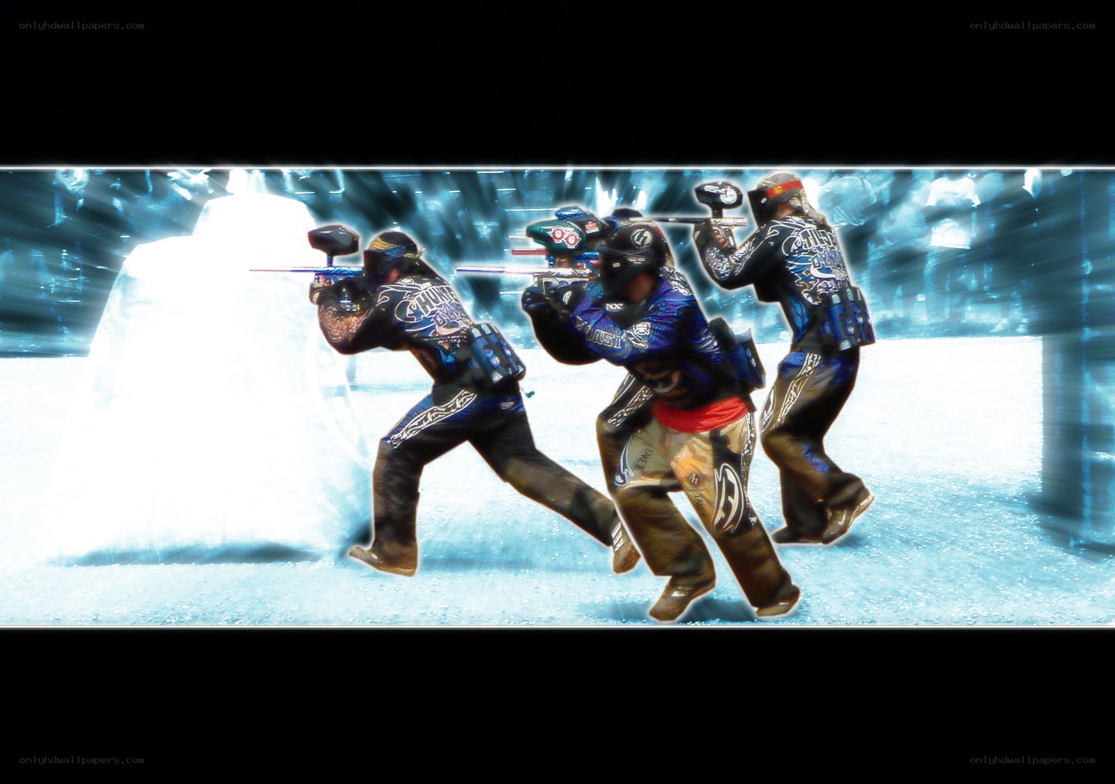 Paintball players in action