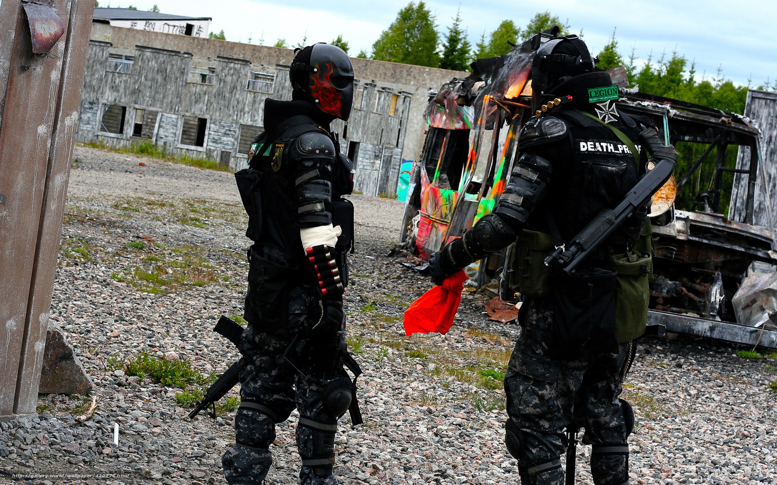 Paintball players in combat gear