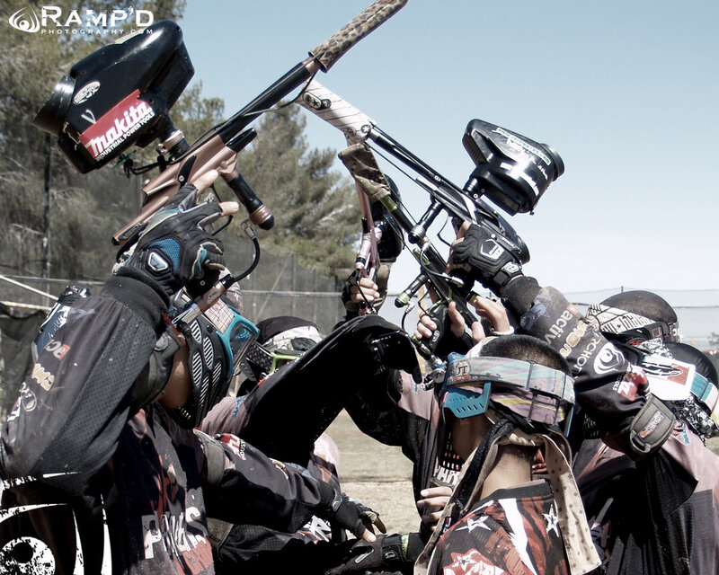 Paintball players in huddle