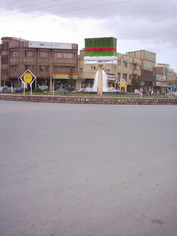 Paintbrush fountain in a city roundabout