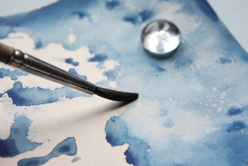 Paintbrush on Watercolor Paper