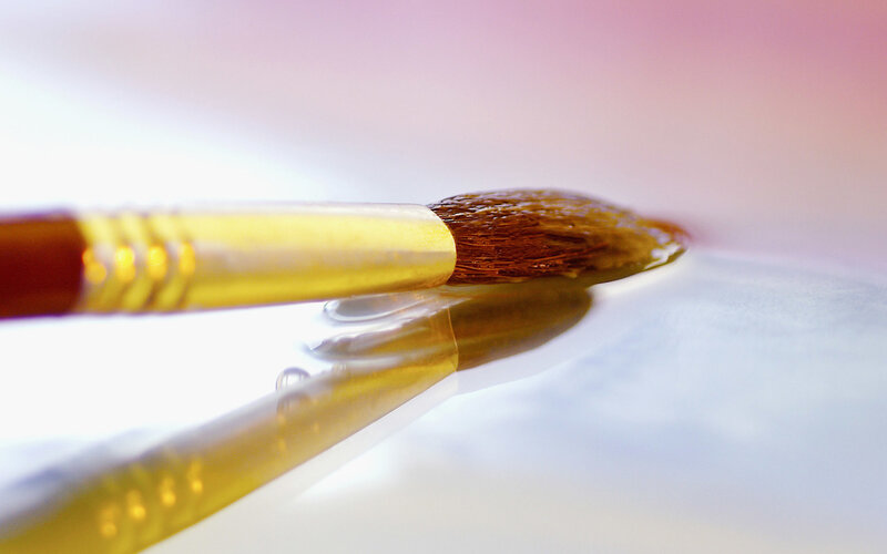 Paintbrush on wet surface