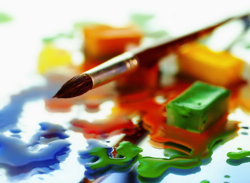 Paintbrush with colorful paints