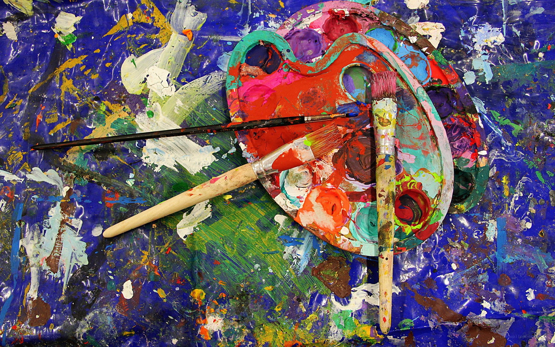 Paintbrushes and palette on canvas