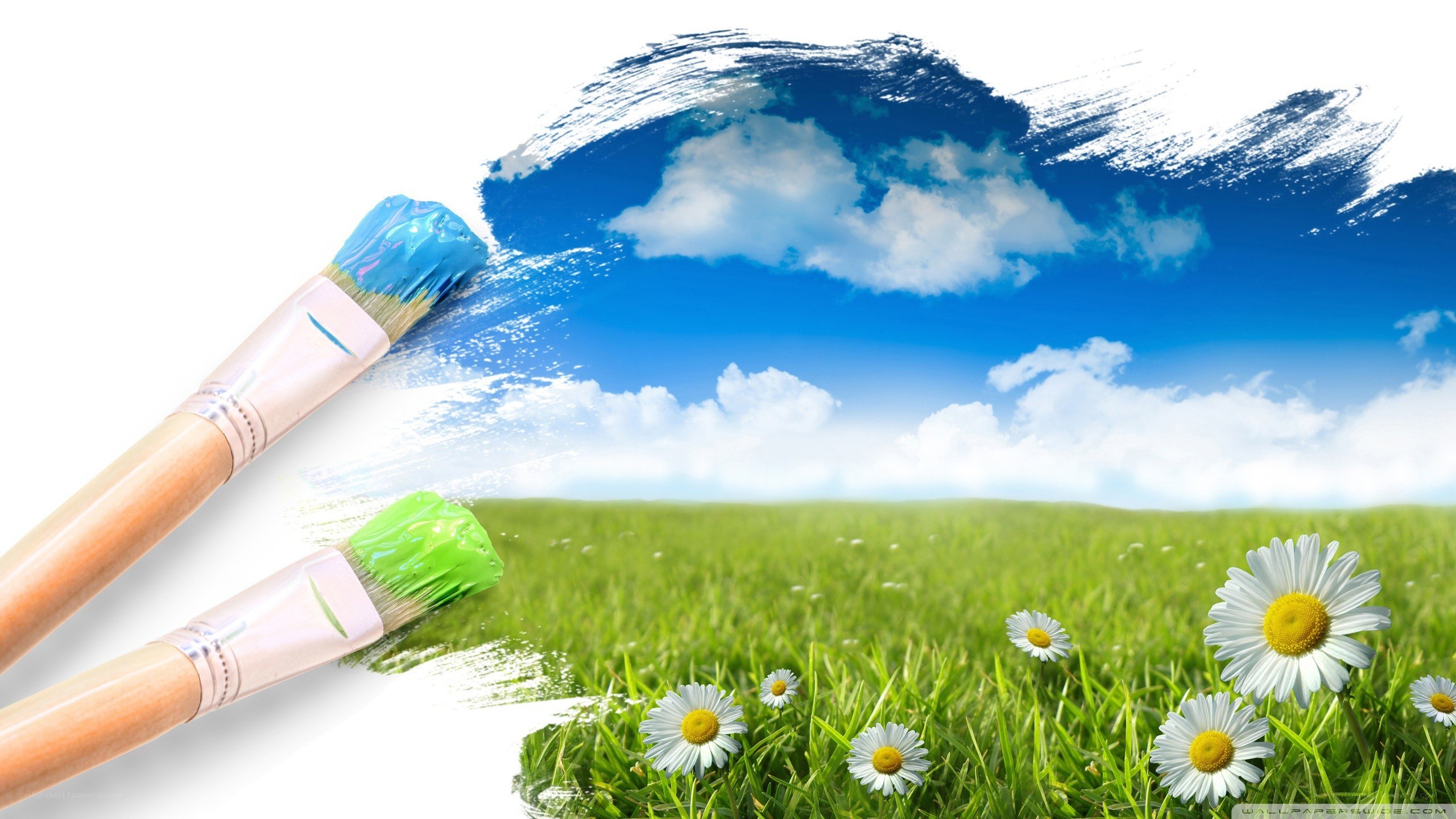 Paintbrushes creating a landscape