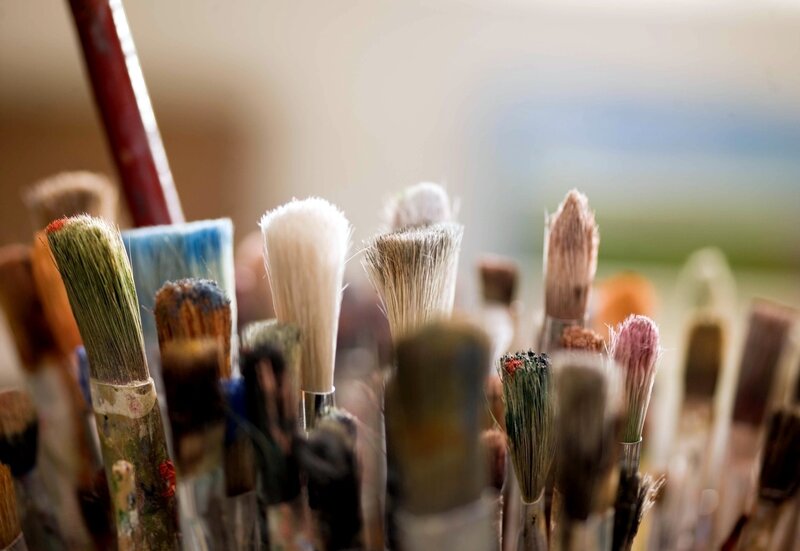 paintbrushes in a container