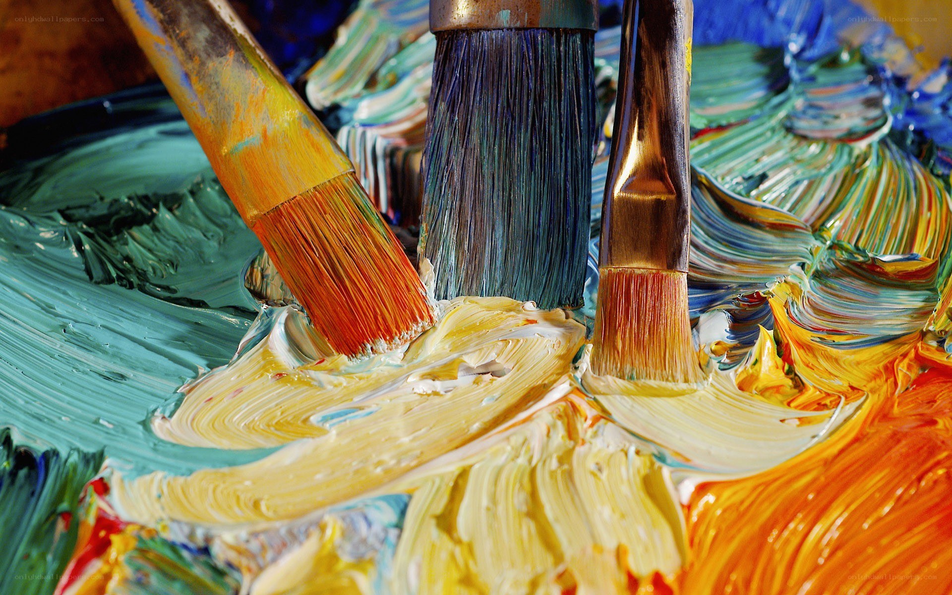 Paintbrushes on a colorful palette
