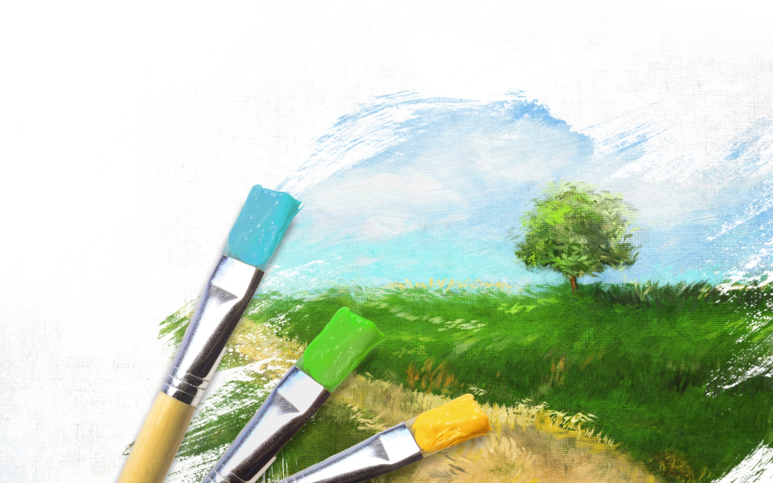 Paintbrushes on landscape painting