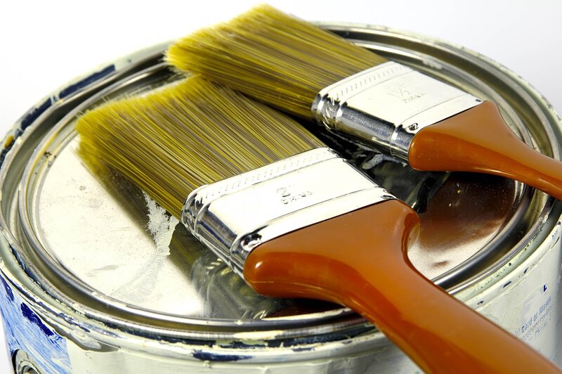 paintbrushes on paint can