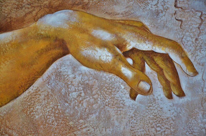 Painted hand on textured surface