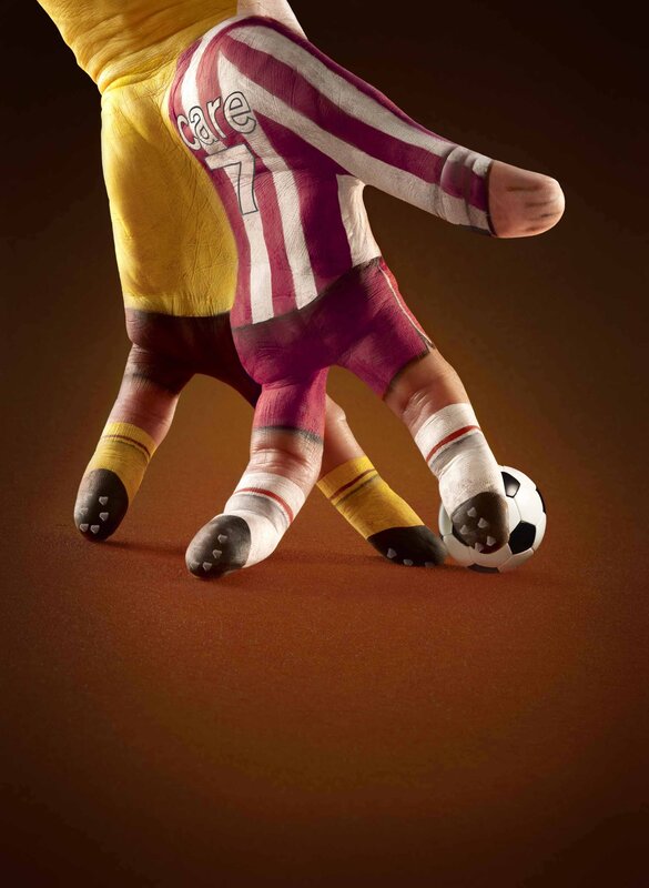 Painted Hands as Soccer Players — Brown