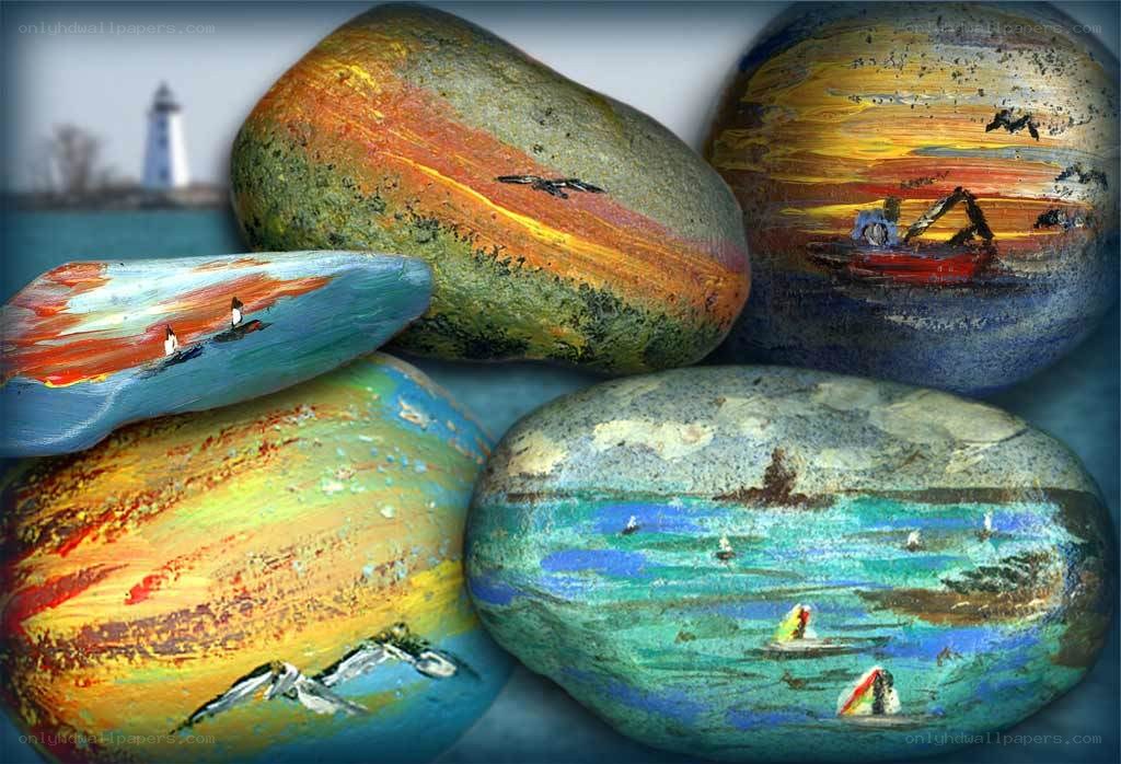 Painted rocks with coastal scenes