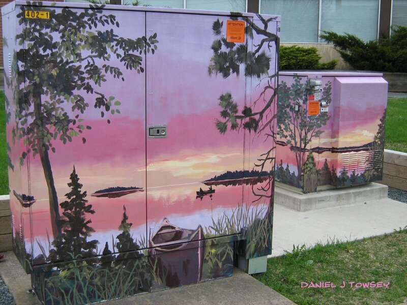 painted utility boxes with sunset scene
