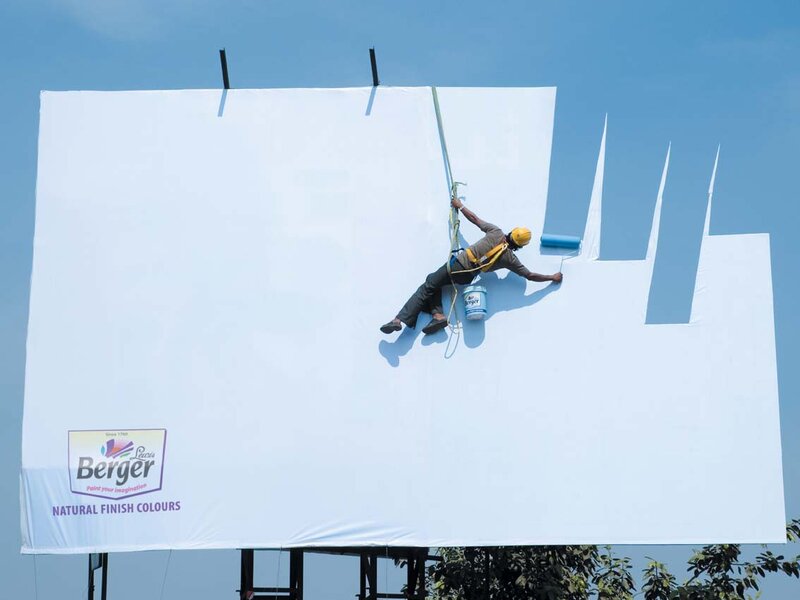 painter on billboard