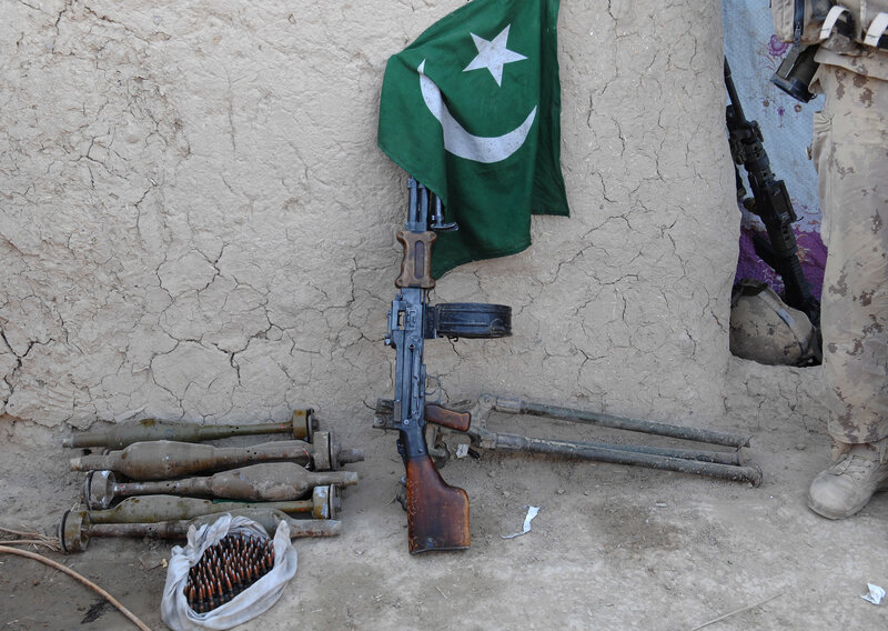 Pakistani flag with weapons