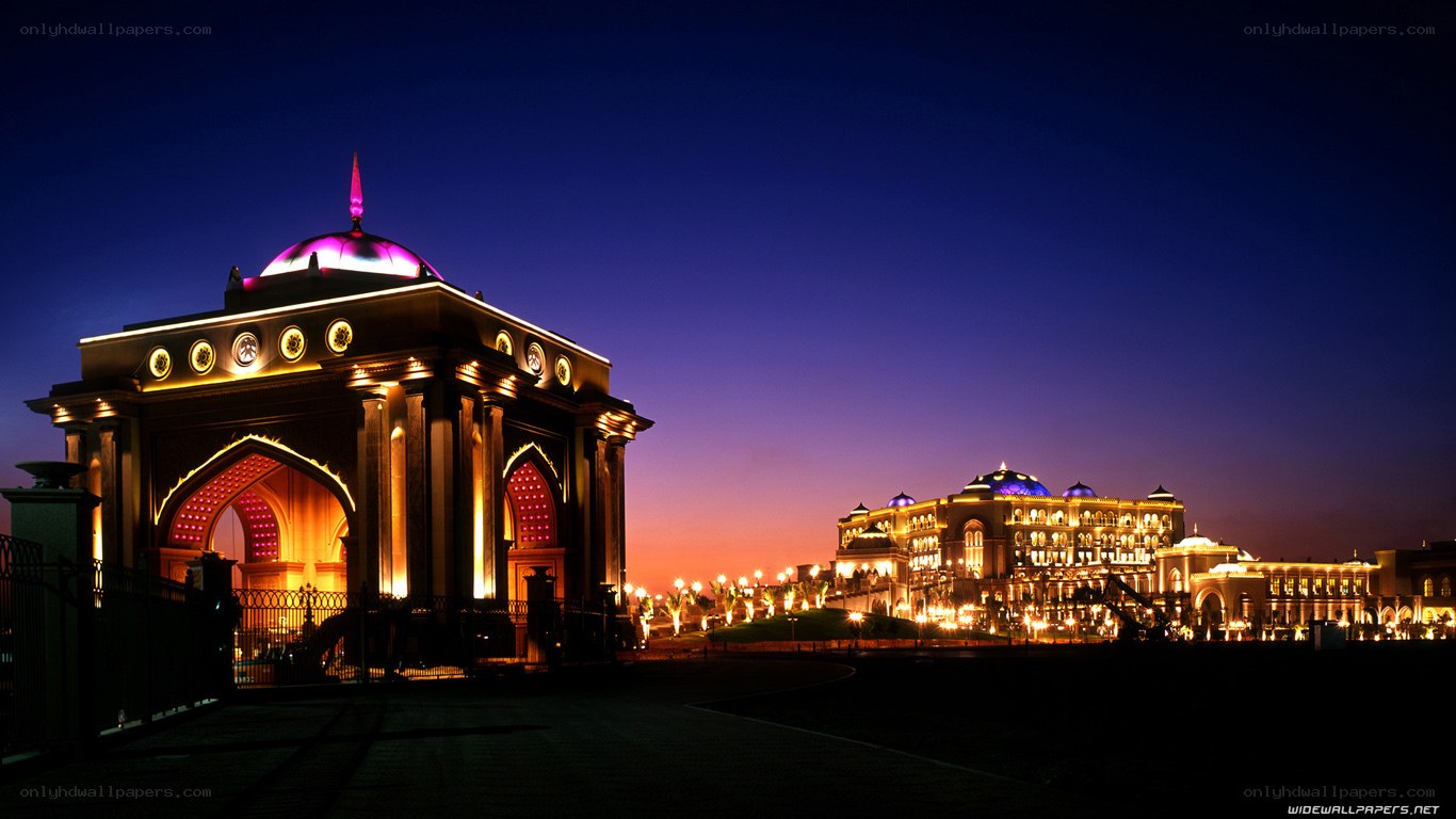Palace at dusk with illuminated arch