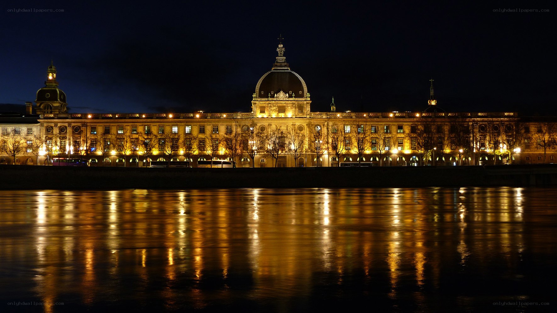 Palace at night with river reflection