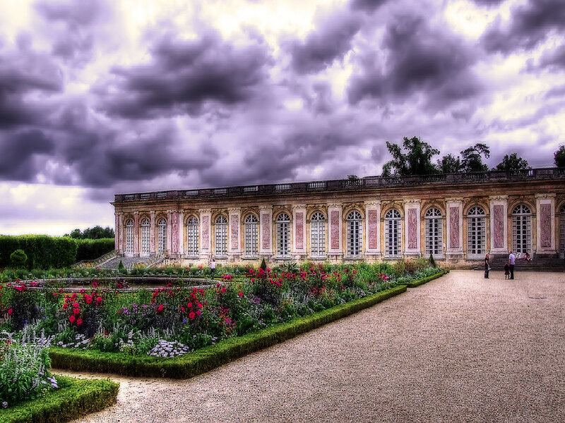 Palace garden under stormy sky