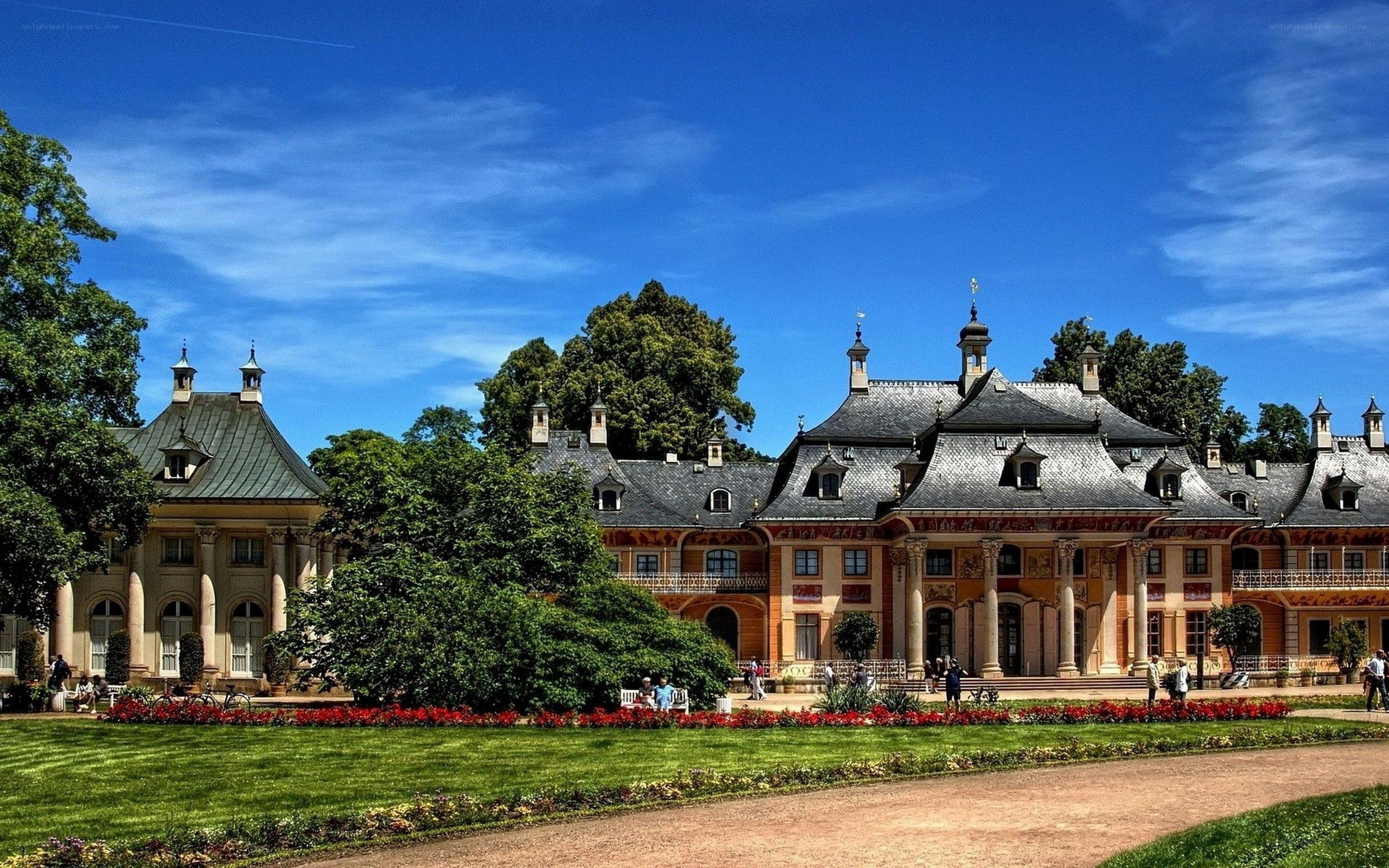 palace with gardens under blue sky