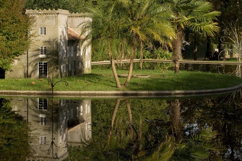 Palm trees and historic building reflection