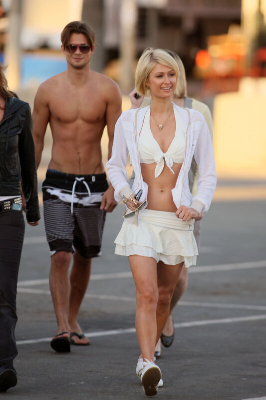 Pals and shirtless man walking