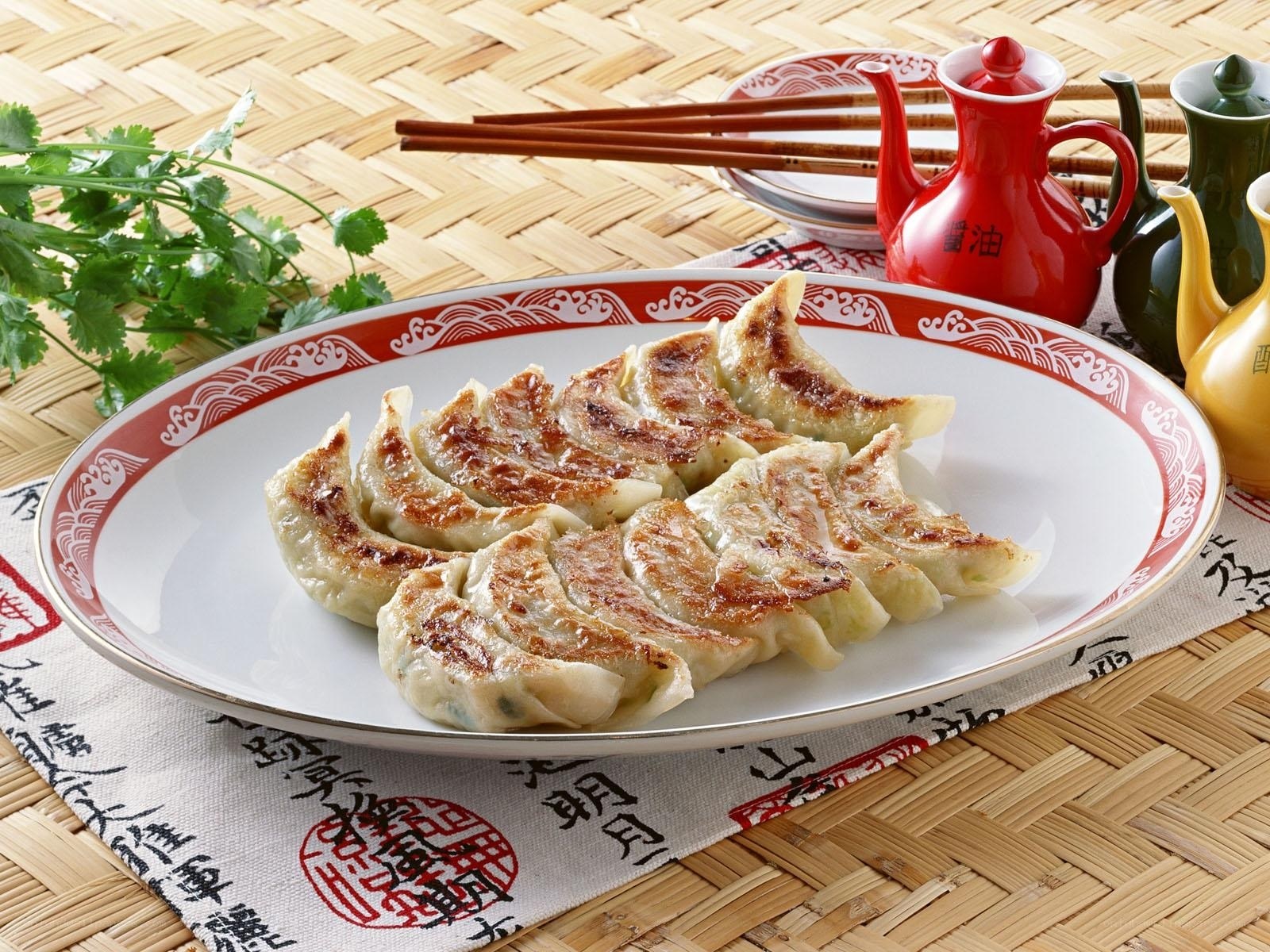 Pan-fried dumplings on a platter