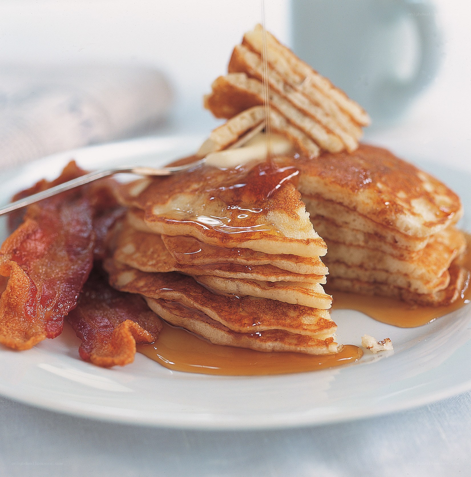 Pancakes with bacon and syrup