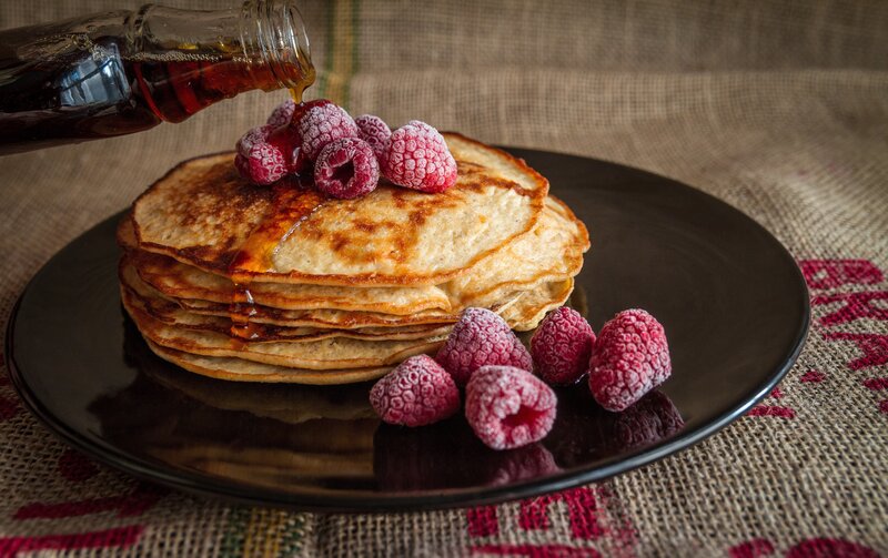 Pancakes with berries and syrup