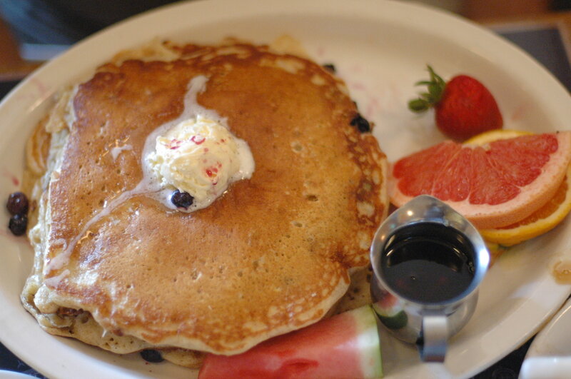 Pancakes with fruit and syrup