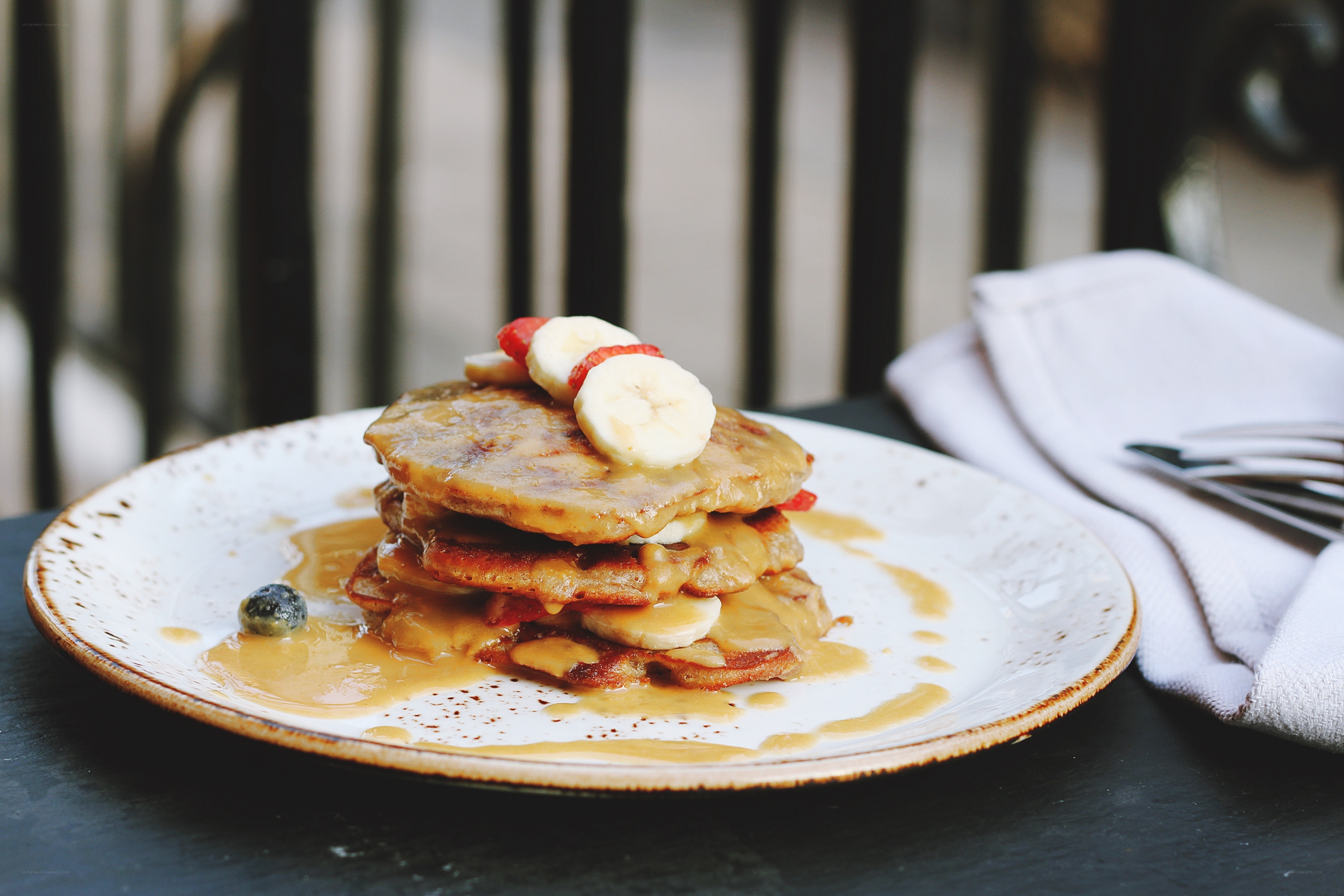 Pancakes with fruit and syrup