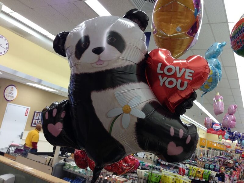 Panda balloon holding heart