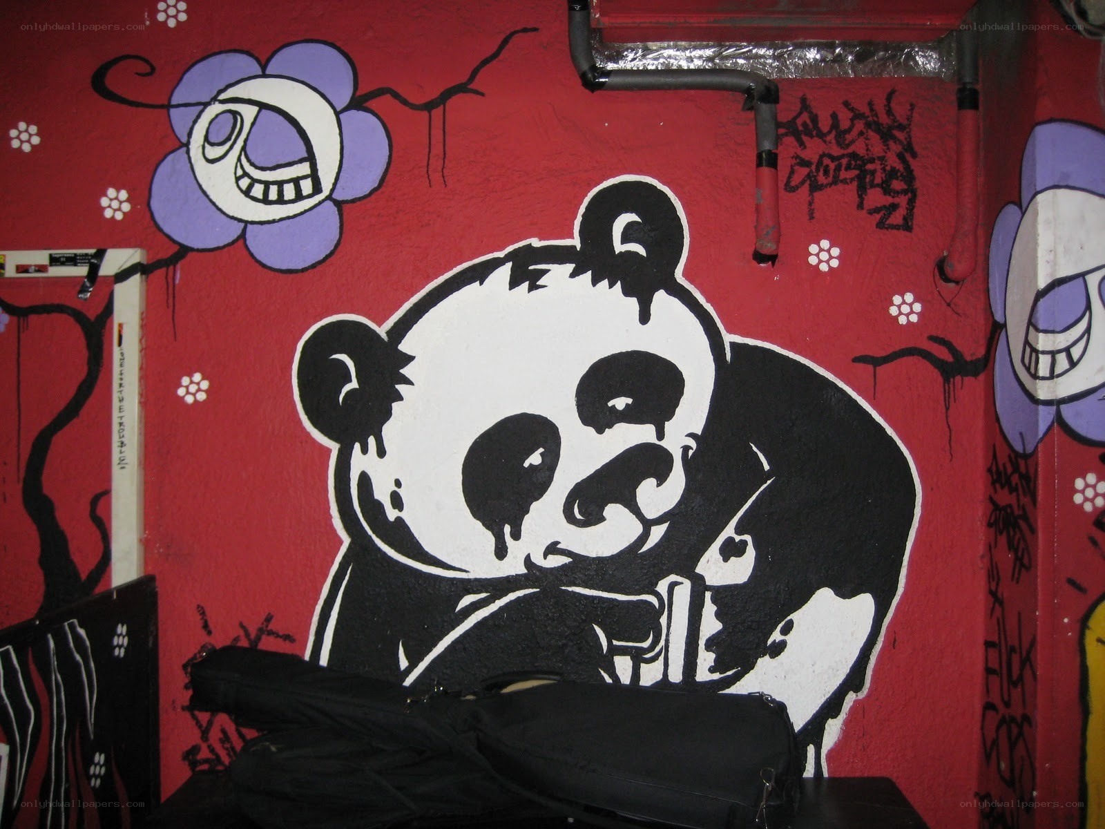 Panda graffiti on red wall