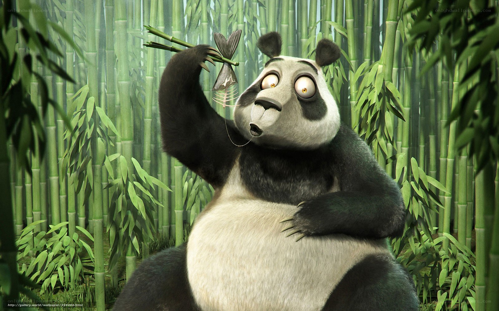 Panda holding fish in bamboo forest