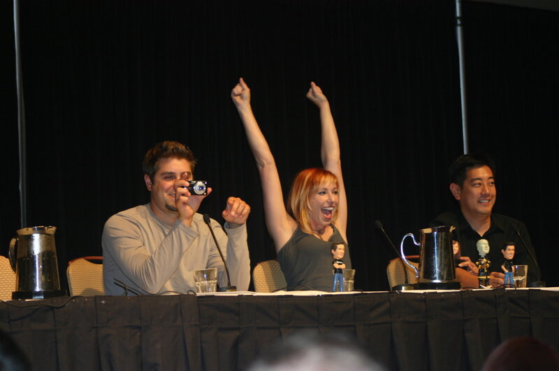 Panelists celebrating on stage