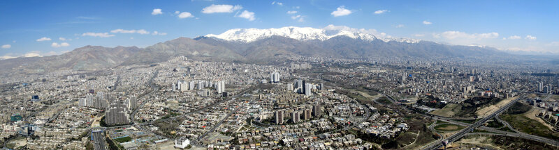 Panoramic City View — Blue, Serene, Afternoon, Photograph, Mountains, Snow-capped Peaks