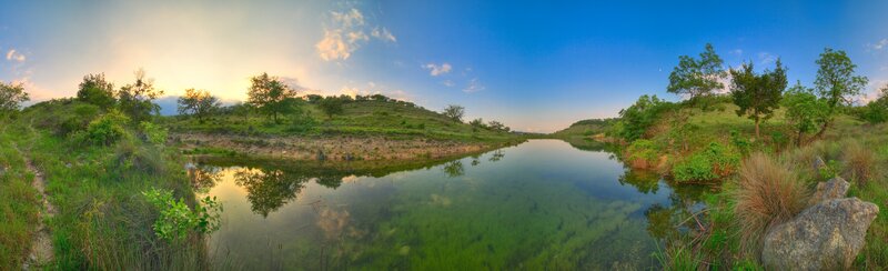Panoramic river landscape at sunset