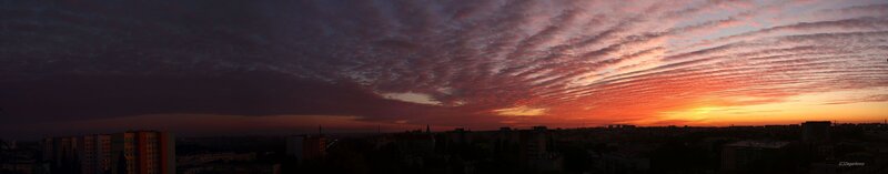 Panoramic sunset over city