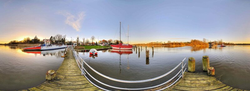 Panoramic view of a harbor at sunset