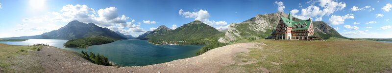 Panoramic view of a lake and mountain lodge