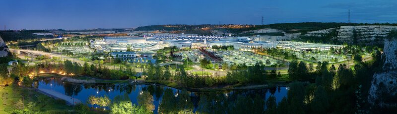 Panoramic view of a large complex at dusk