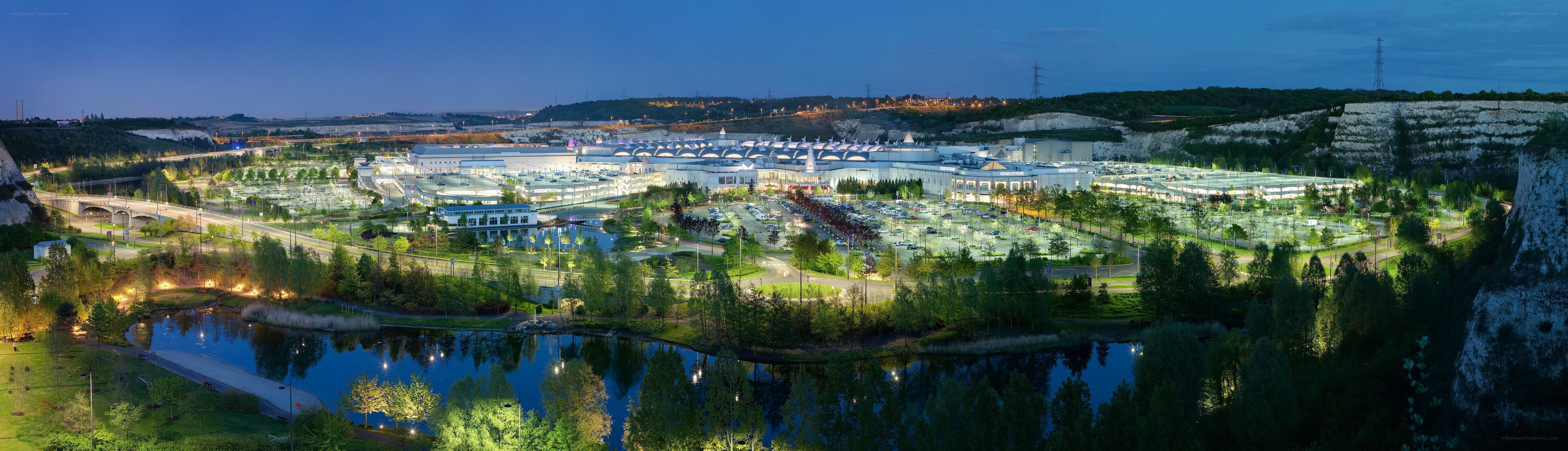 Panoramic view of a large complex at dusk