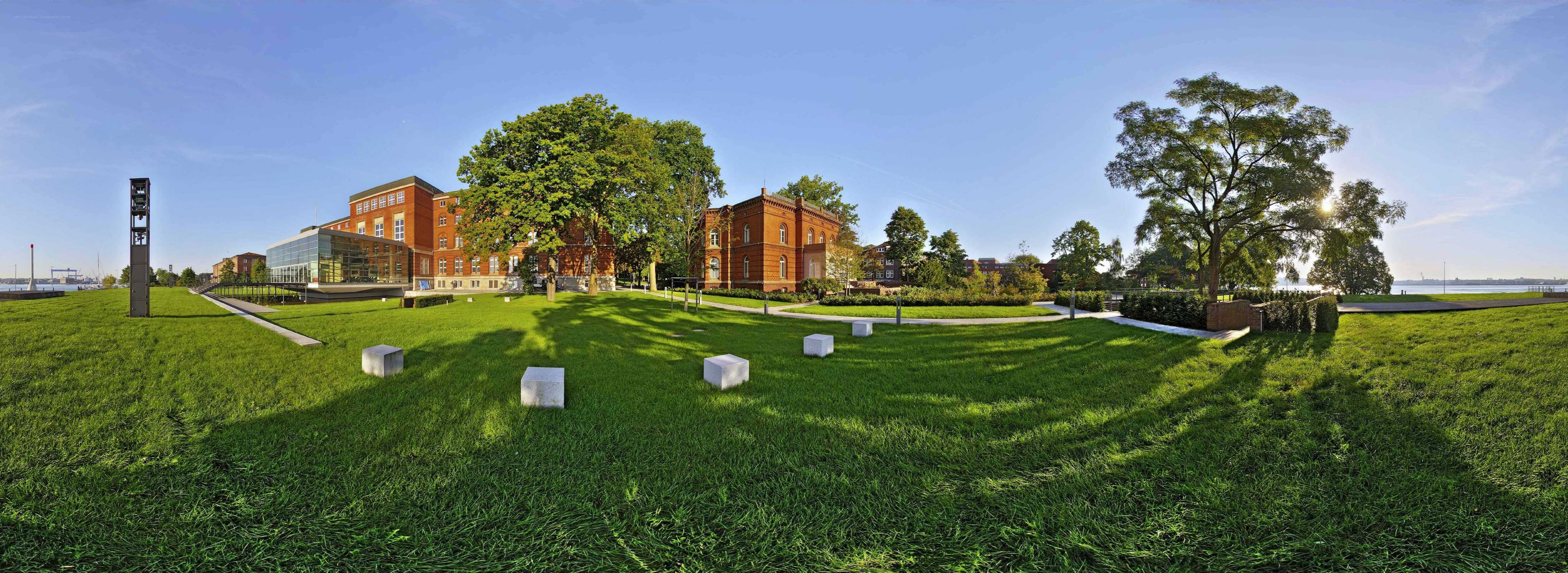 Panoramic view of a riverside campus