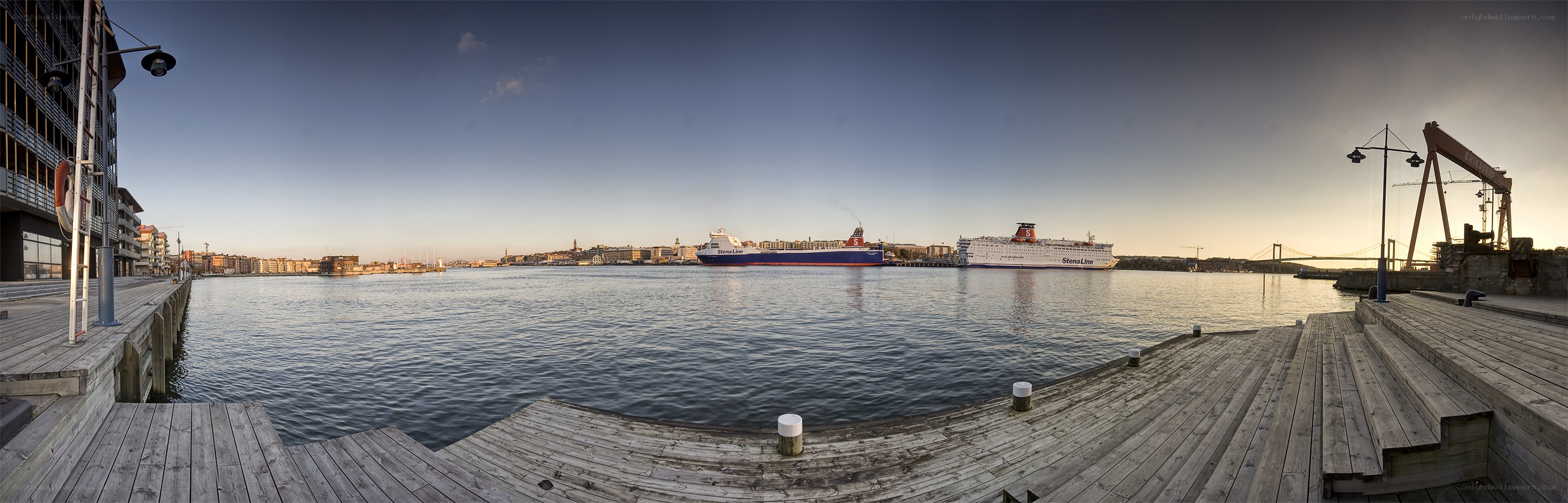 Panoramic view of harbor at sunset