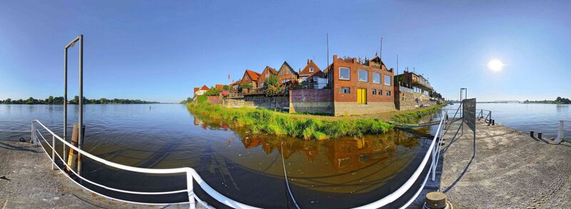 Panoramic view of riverside buildings